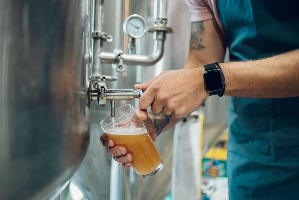 Man pouring a beer at a brewery in Margaret River