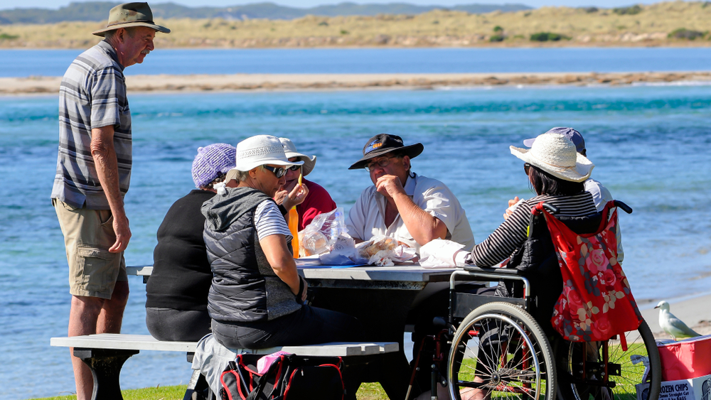 A group enjoying the scenic view and food in Flinders Bay, Augusta